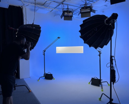 Studio lights projecting blue on product being photographed